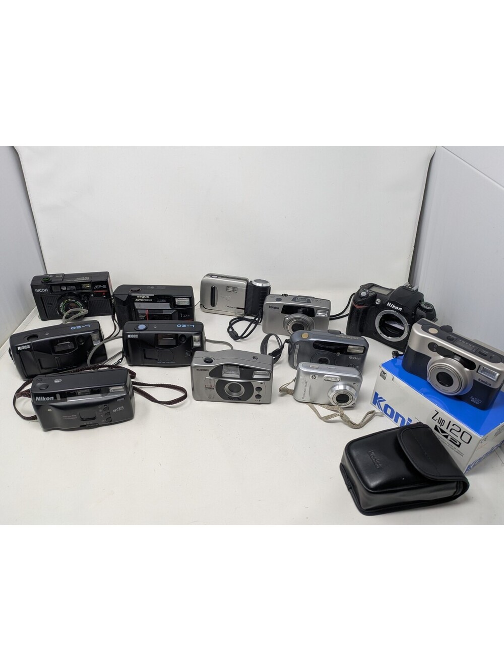 Lot Of 13 Point & Shoot Cameras-Pentax,Ricoh,Konica, Nikon,Fuji, HP,Bell&Howell